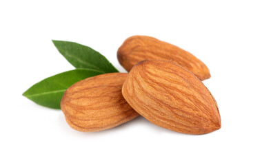 Organic almond nuts and green leaves on white background. Healthy snack