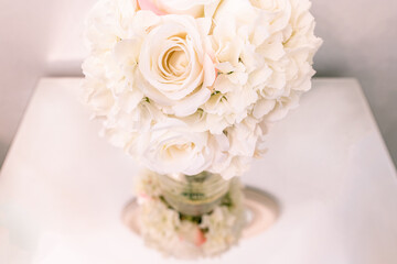 white bouquet of roses and reflection