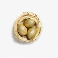 Golden color eggs in nest from straw on white background. Stylish gold egg for easter spring holiday. Top view decorative shiny Easter eggs minimal style card