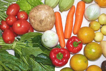 Fresh fruits and vegetables. Nutritious food. Vegetarian Food. Basic food. Carrot, orange, red pepper, yellow pepper, broccoli, white onion, purple onion, spinach, nopales, tomato, green bean, chard, 