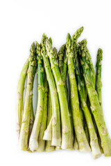 Group of raw green asparagus isolated on white background.