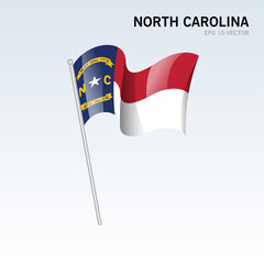 Waving flag of North Carolina state of United States of America on gray background