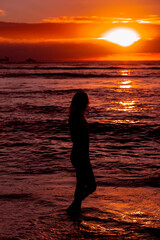 Hawaii Sunset Silhouette of Surfer Girl
