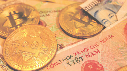 Close up the Vietnamese Dong Banknotes and Bitcoin