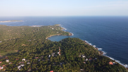 Fototapeta premium Aerial view of an emerald green sea and big foaming waves. Indian Ocean. Dikwella beach. Sri Lanka