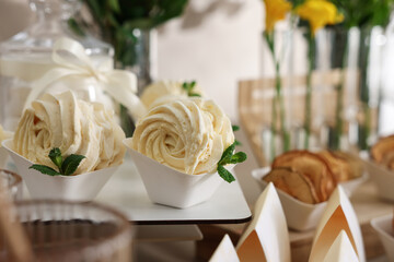 Tasty treats on table in room. Sweet buffet