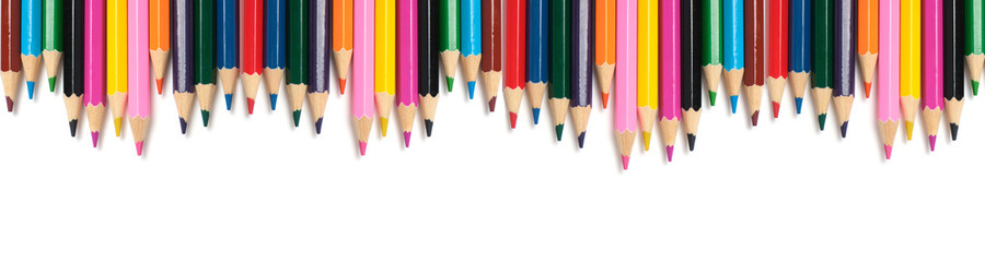 Banner,bright colored pencils on a white background.School supplies for drawing.