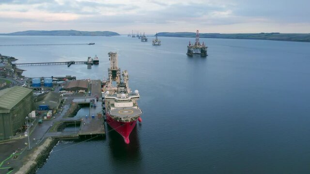 Pipe Laying Ship Docked at Port Loading Equipment