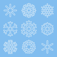 White outline of snowflakes isolated on blue background. Traditional, standard snowflakes. Simple forms and symbols. Glass stickers.