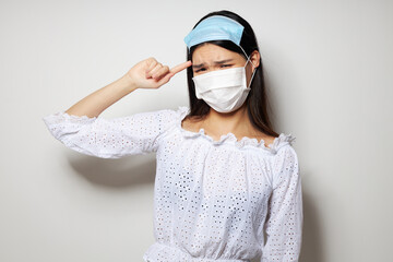 woman two medical masks on the head protection isolated background unaltered