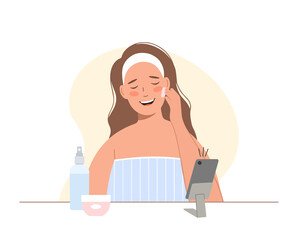 Beauty blogger. Cosmetics procedures tutorial video . Young woman takes care of her face and recording video.