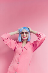 woman in blue wig pink dress red lips Lifestyle posing
