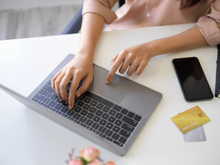 Top view of a female using laptop computer.