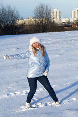 Portrait of a girl in winter clothes. Woman posing on a walk in a winter park. Rostov portrait.