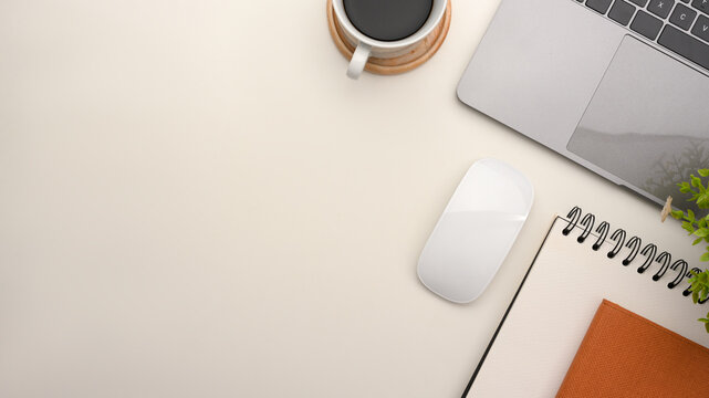Fototapeta Simple office workspace with notebook laptop and copy space on white background.