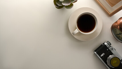 Minimalist working table with copy space on white background.