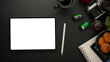 Creative photographer studio workspace with digital tablet