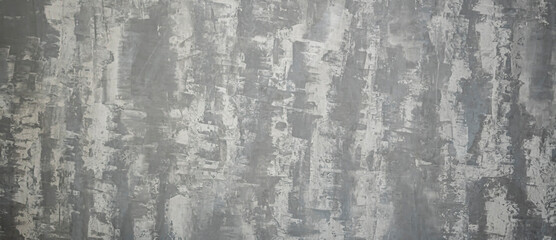 Blurred creative wall pattern. Handmade design in a living room. Gray material, dark abstract lines and shapes. No selective focus, defocused background.