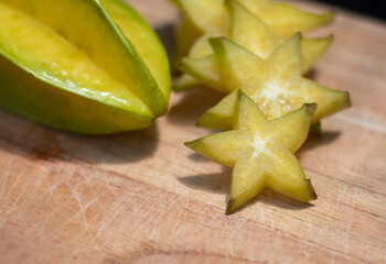 Carambola or starfruit sliced on a wooden board .exotic fruit. Healthy Food.