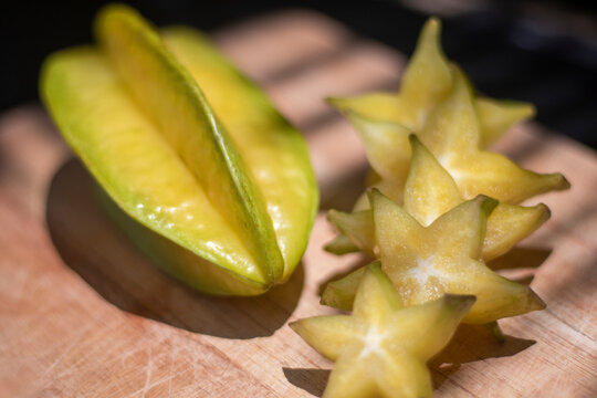 Carambola or starfruit sliced on a wooden board .exotic fruit. Healthy Food.