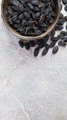 Dark raisins on light background.