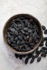 Dark raisins on light background.
