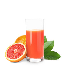 Glass of grapefruit juice, fresh fruits and green leaves on white background