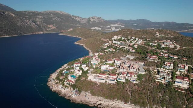 Flying over the bay and the peninsula built up with villas in the area of the city of Kash