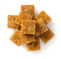 Brown sugar cubes isolated on white background, top view
