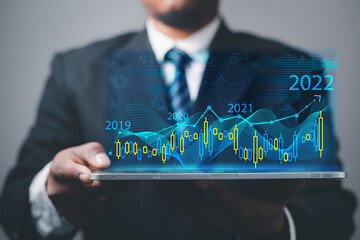 2022 business concept, businessman or engineer Show the trend of driving digital currency to develop online business.
