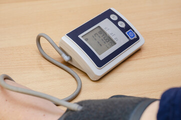 Measuring blood pressure and heart rate at home.