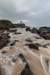 High tide water flowing into the coastline.