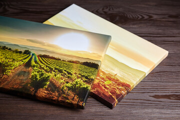 Gallery wrapped canvas photo prints on wooden table