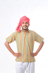 Young indian farmer in traditional wear and giving expression on white background.