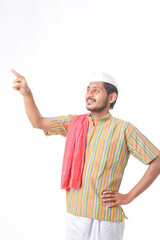 Young indian farmer in traditional wear and giving expression on white background.