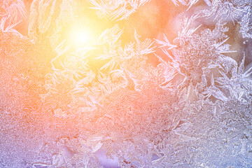 Frost texture on frozen glass illuminated by the sun in winter.
