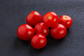 Ripe juicy cherry tomatoes heap