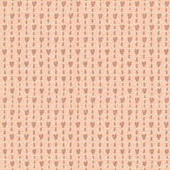 seamless pattern with hearts and small specks on a beige background of brown shades to create textures