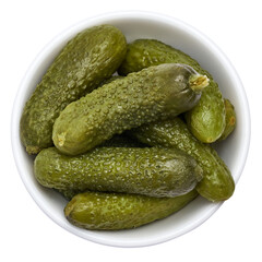Bowl of Tasty canned Whole green cornichons isolated on a white background