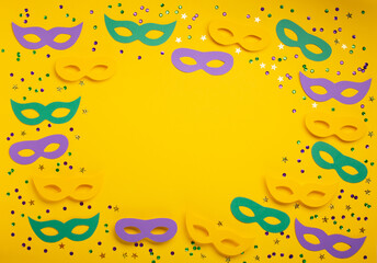 Mardi Gras gold color beads with Masquerade festival carnival masks and golden, green, purple...