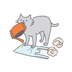 ゴミをくわえる猫