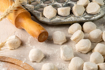 Raw homemade dumplings. Russian traditional dumplings with meat.