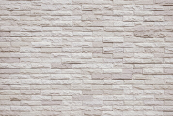 Cream and beige brick wall texture background. Brickwork and stonework flooring interior