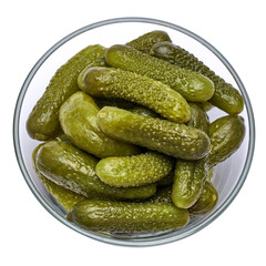 Bowl of Tasty canned Whole green cornichons isolated on a white background