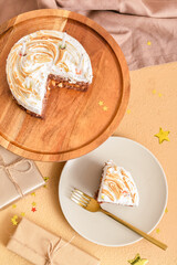 Plate with piece of tasty birthday cake and gifts on color background