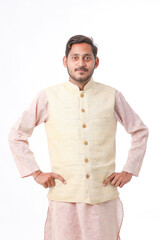 Young indian farmer in traditional wear and giving expression on white background.