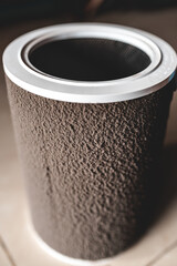 Close up of a dirty used air purifier HEPA filter with dust created by PM 2.5 particles, other pollutants and micro organisms trapped on the filter.