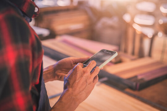 Carpenter working with equipment on wooden table in carpentry shop. men works in a carpentry shop.