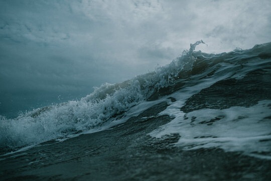 waves crashing on beach, dark, winter waves © Reuben