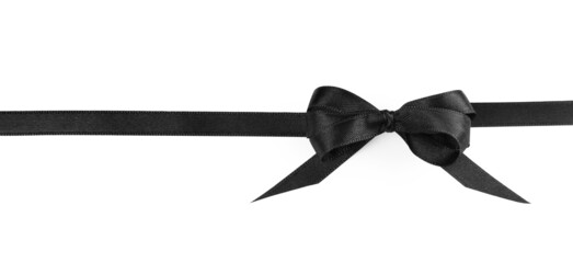 Elegant black ribbon with bow isolated on white, top view